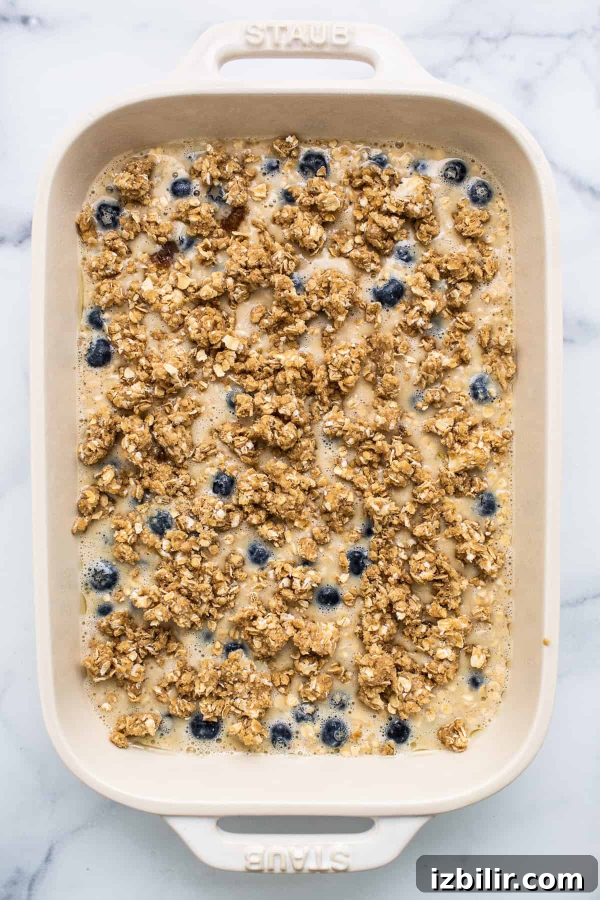 Blueberry muffin baked oatmeal batter with a streusel topping.