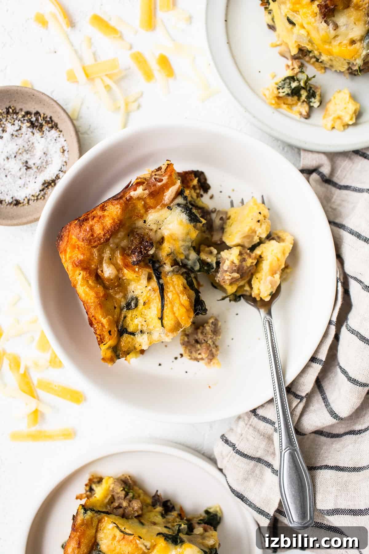 Slice of breakfast strata on a plate.