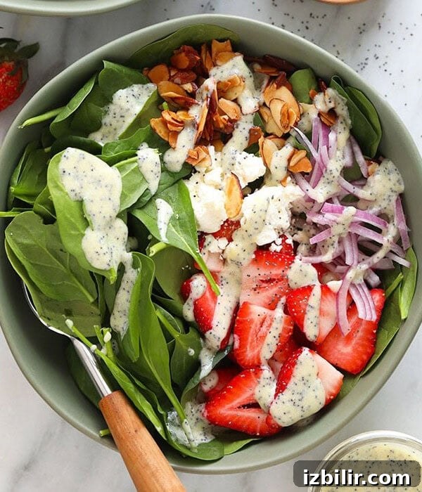 A bowl of strawberry spinach salad