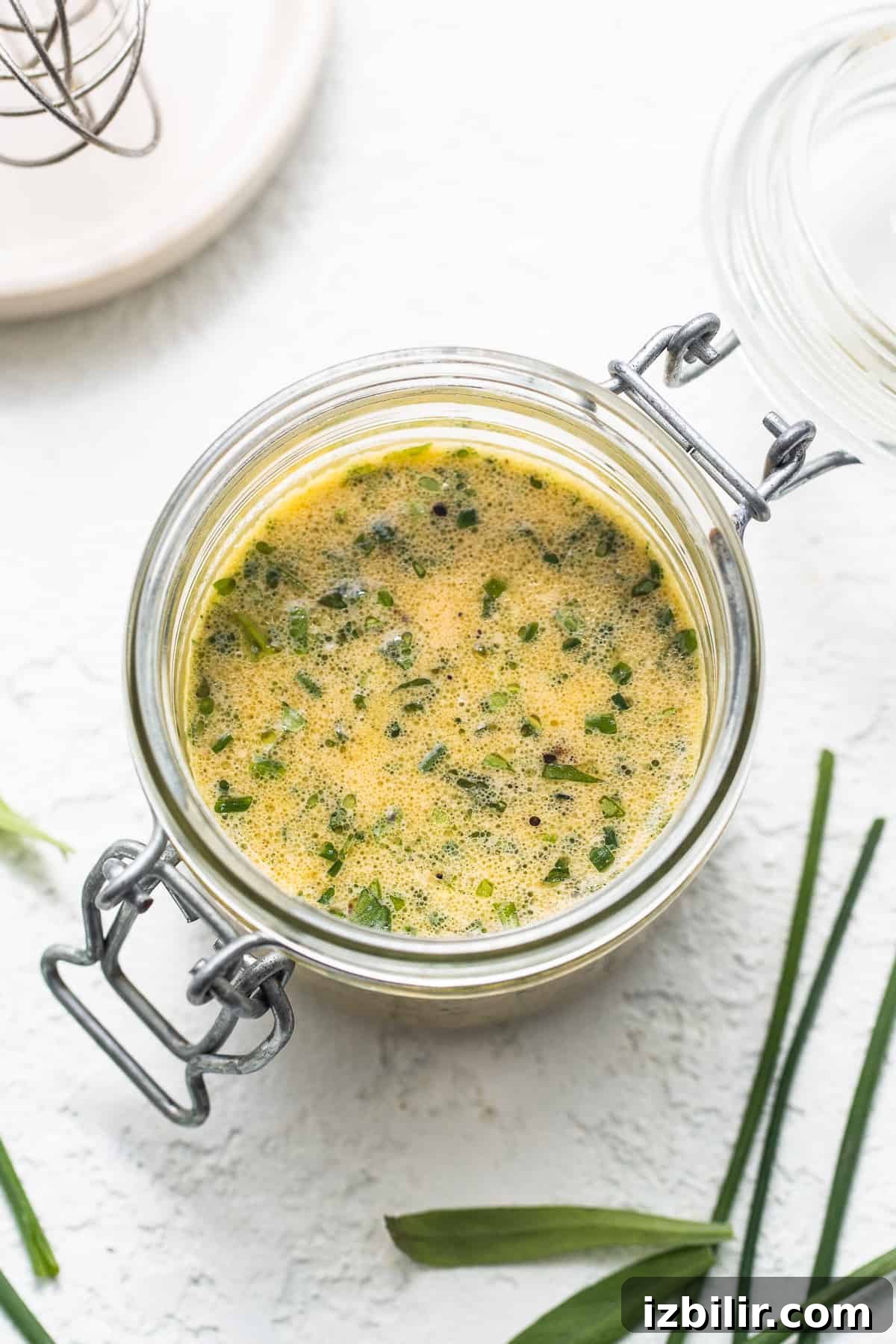 Herby hummus dressing in a jar hummus dressing in jar.