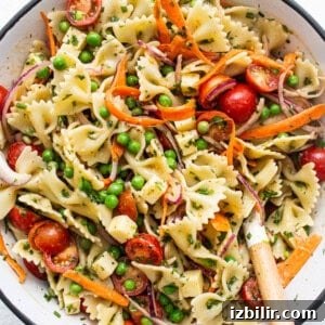 Creamy Herbed Hummus Dressing Recipe for Salads and Grain Bowls 2 Bow tie pasta salad in a bowl.