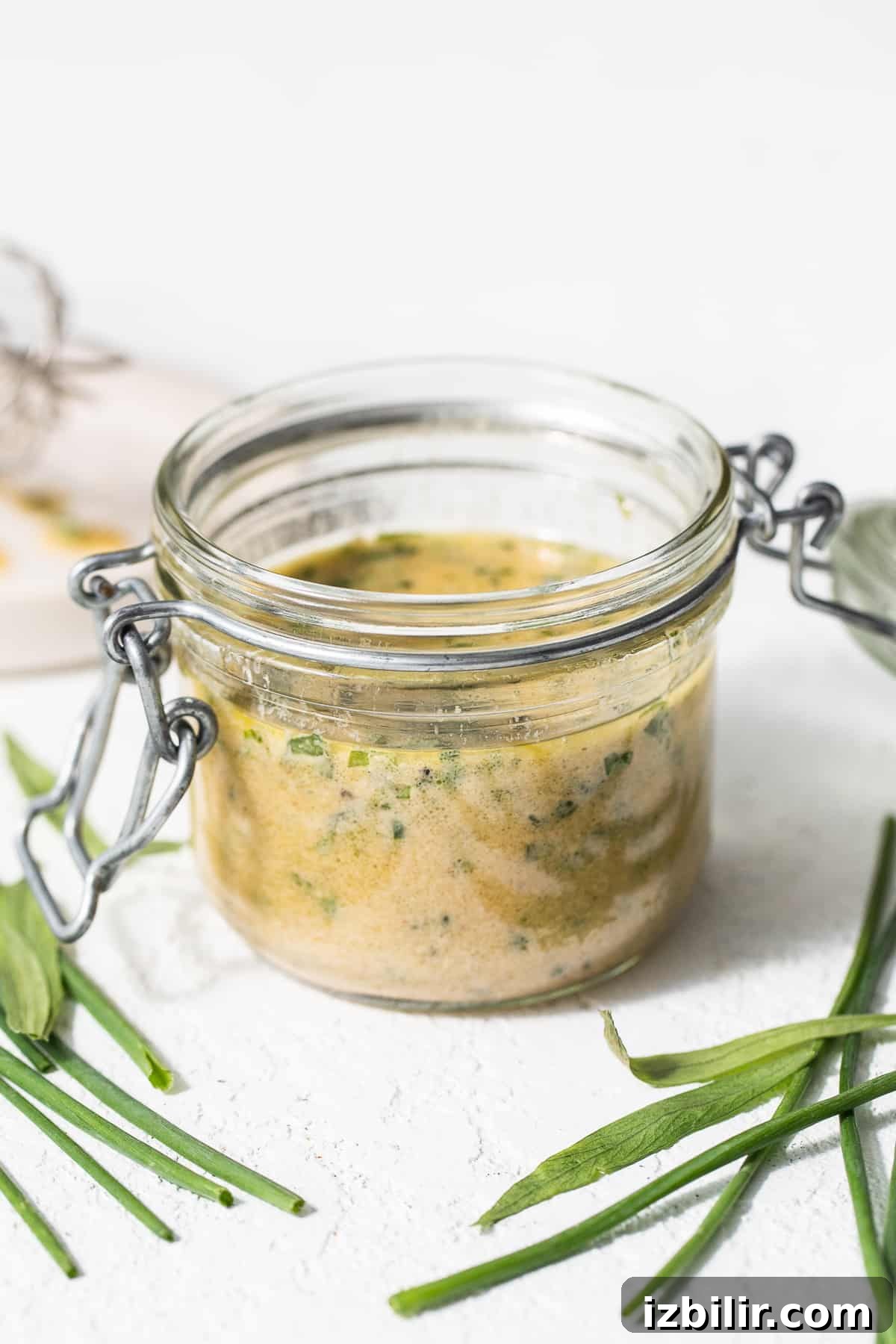 Jar of herby hummus dressing hummus dressing in jar.