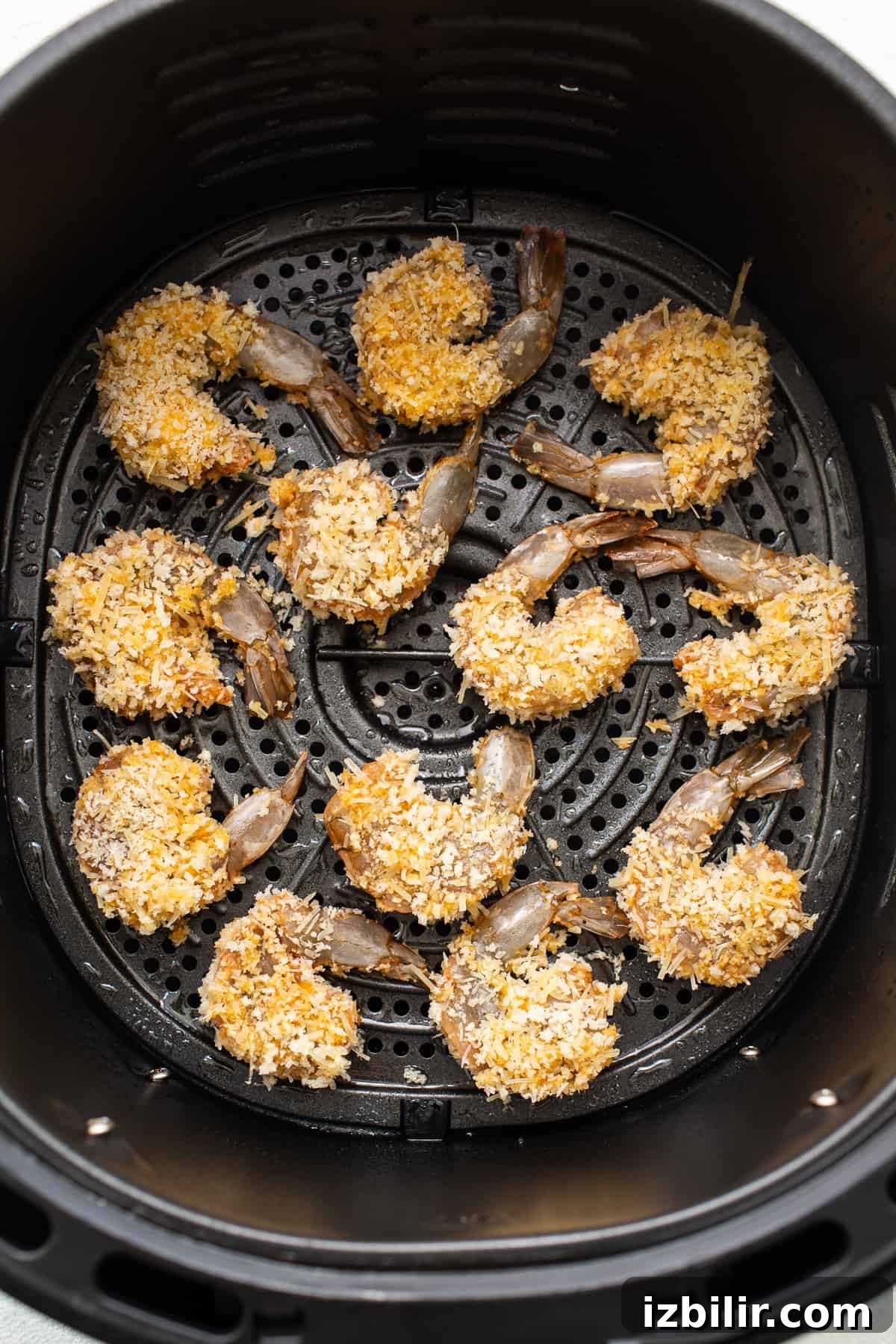 Breaded shrimp in an air fryer.