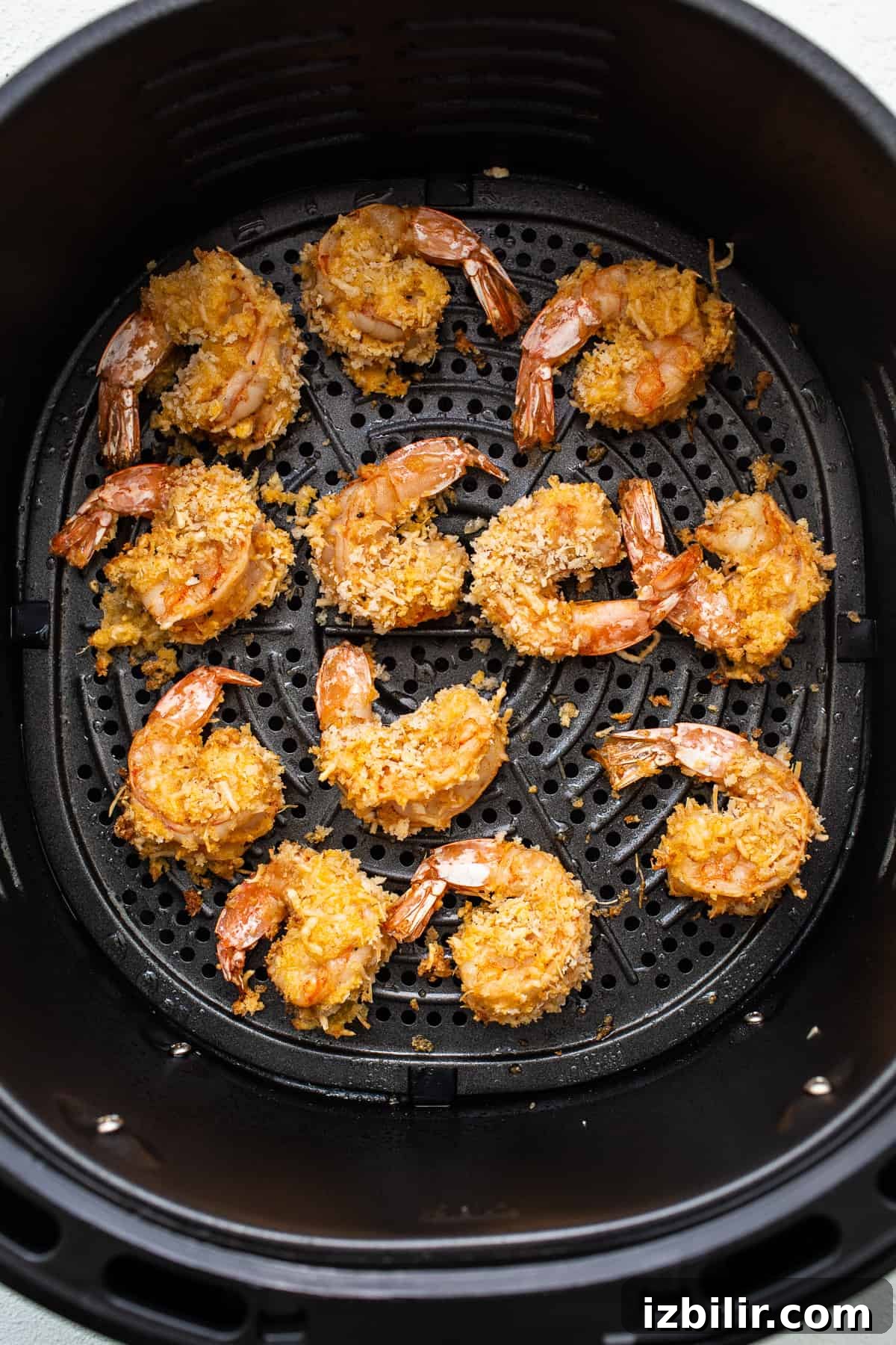 Cooked shrimp in an air fryer.