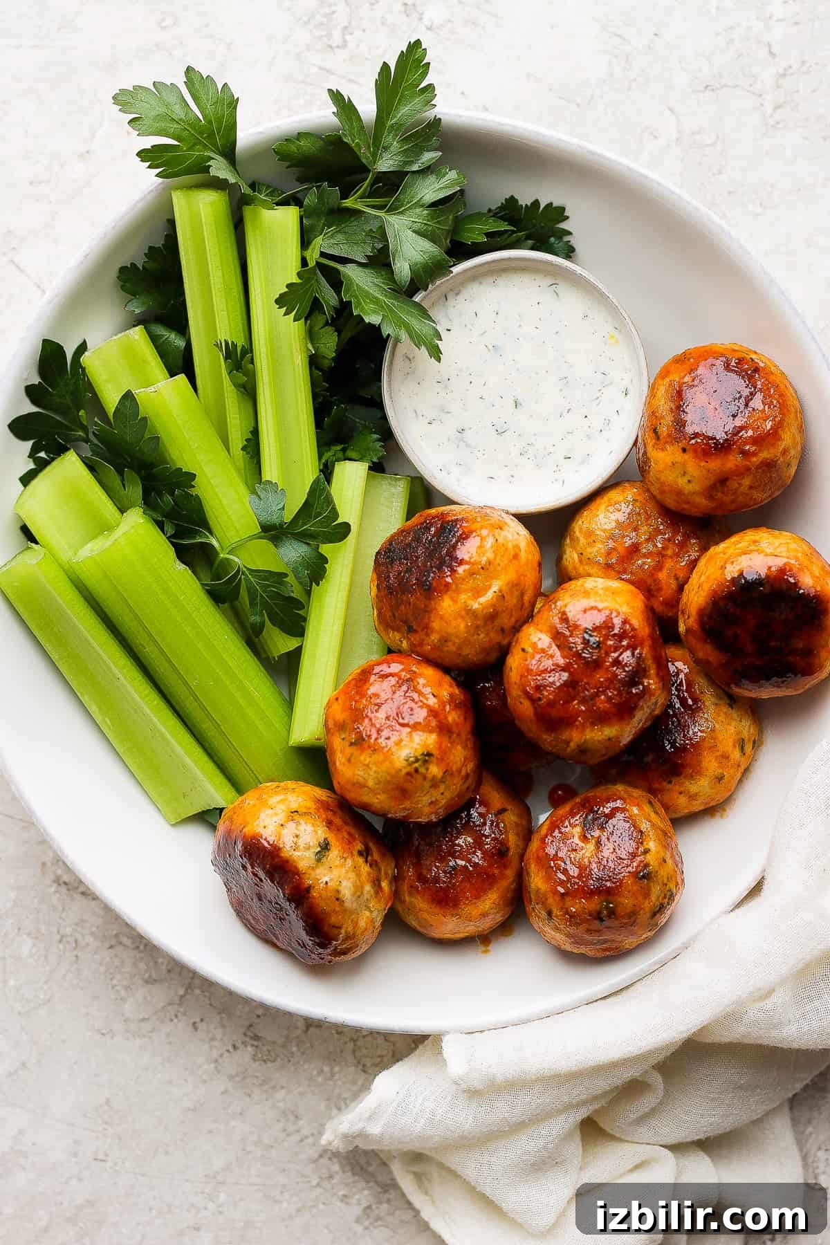 buffalo chicken meatballs on plate with ranch