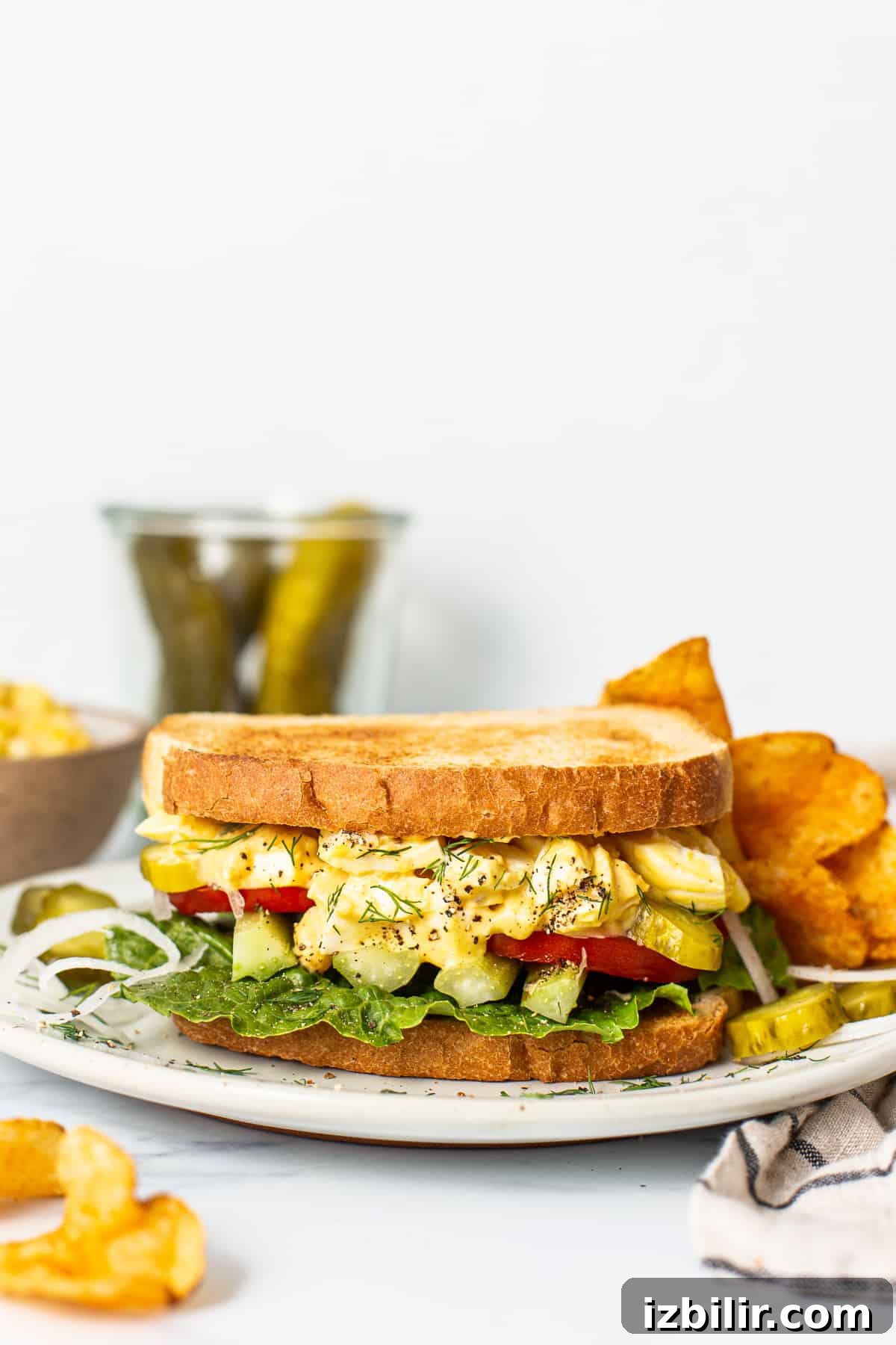 Creamy Homemade Egg Salad Sandwich 5 Egg salad sandwich on a plate.