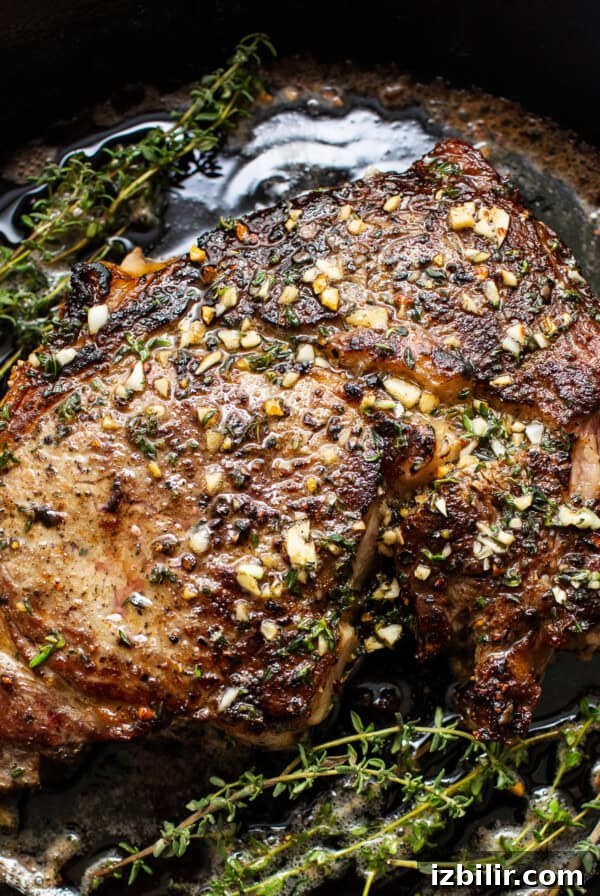 Cast iron steak in a pan.