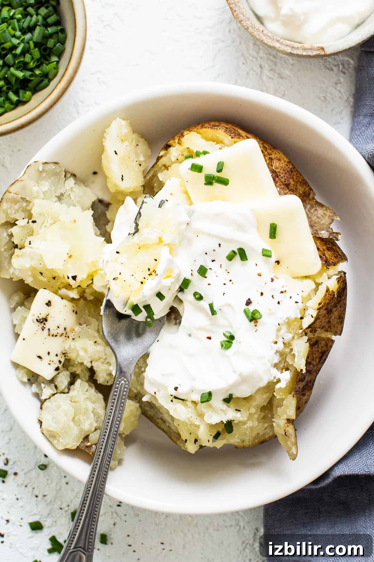 Instant Pot baked potatoes baked potato in bowl.