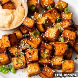 How to Make Crispy Pan-Fried Tofu 2 Air fryer tofu on a plate with dipping sauce