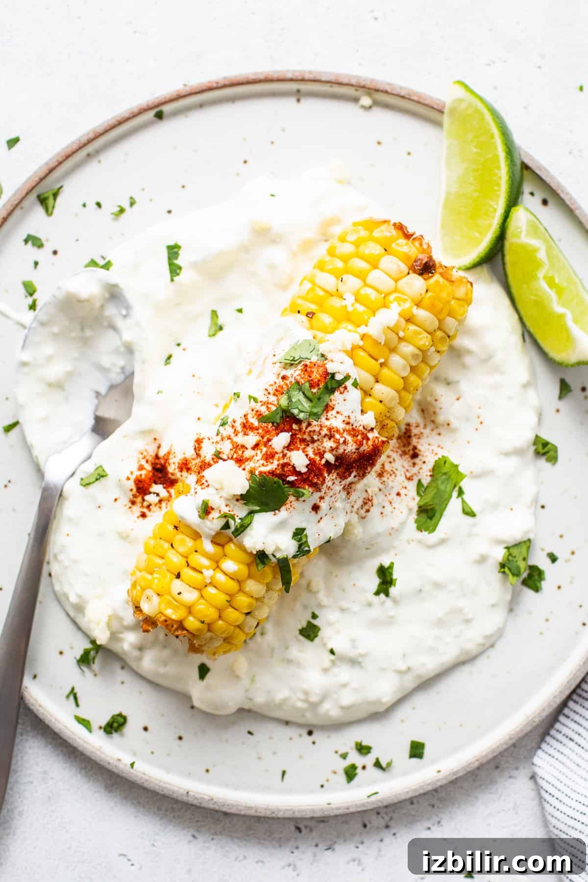 Air fryer elote on a plate.
