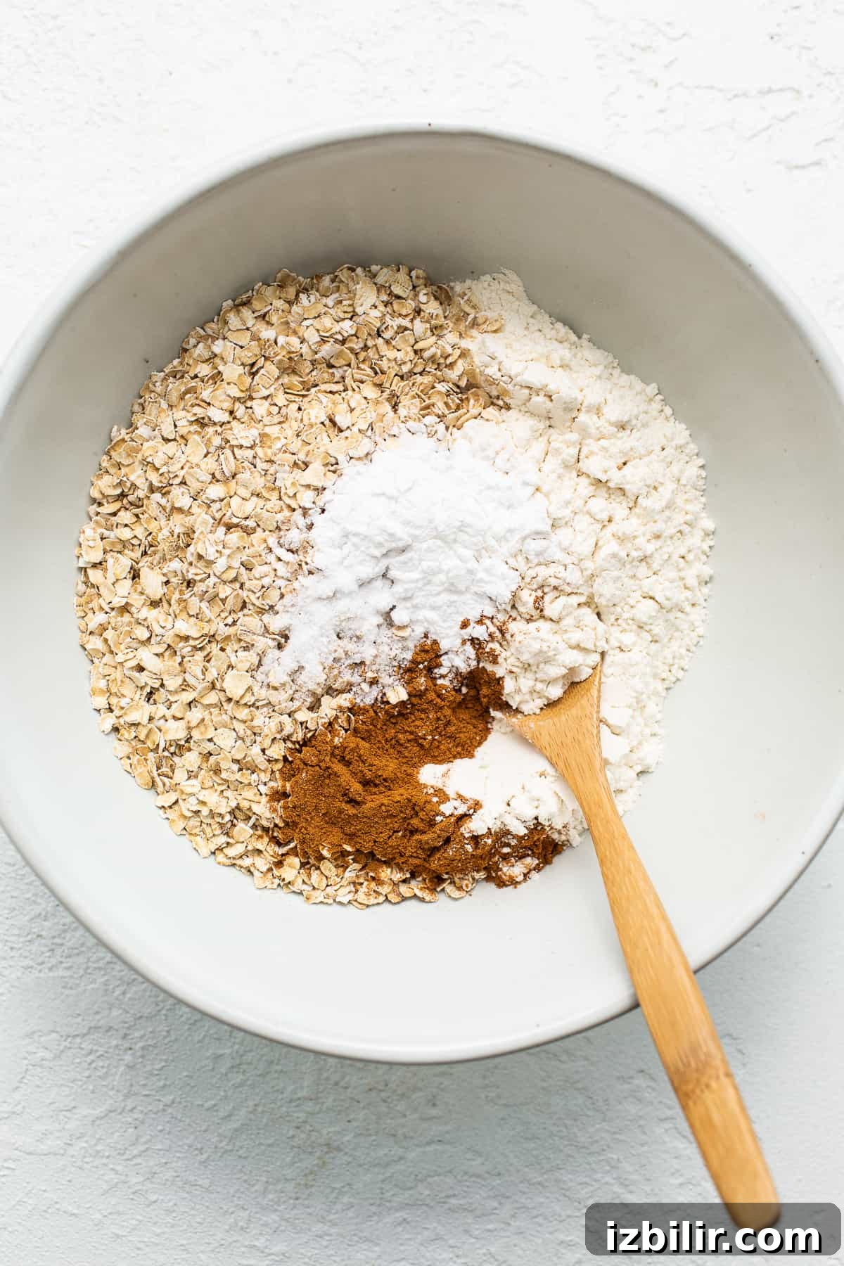 Dry ingredients for Tres Leches Baked Oatmeal Dry ingredients in a bowl.