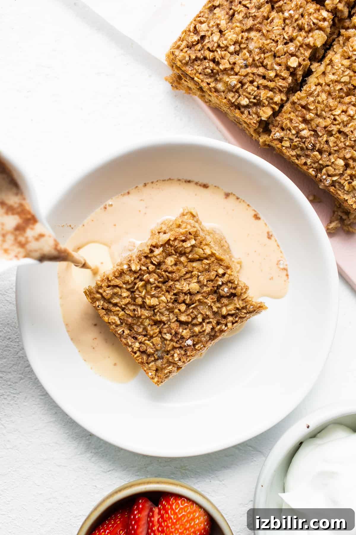 Serve Tres Leches Baked Oatmeal Slice of tres leches baked oatmeal on a plate.