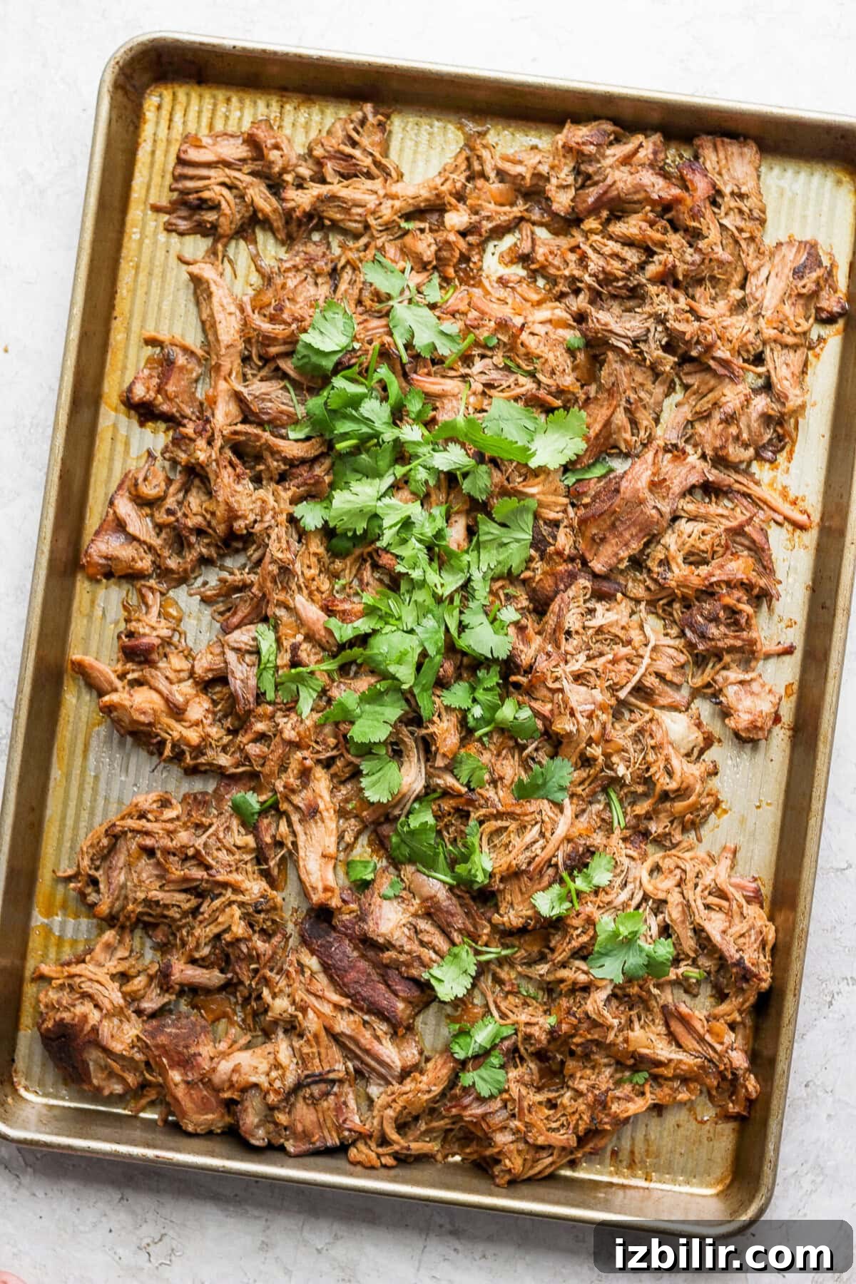 Slow Cooker Carnitas Burrito Bowls with Cilantro Lime Rice 3 Carnitas on a baking sheet
