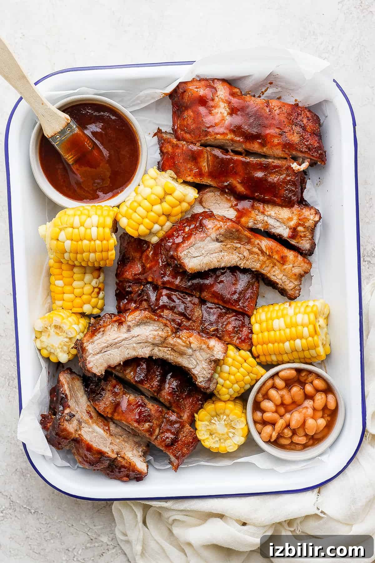 Grilled ribs with BBQ sauce Grilled ribs on a serving tray with BBQ sauce.