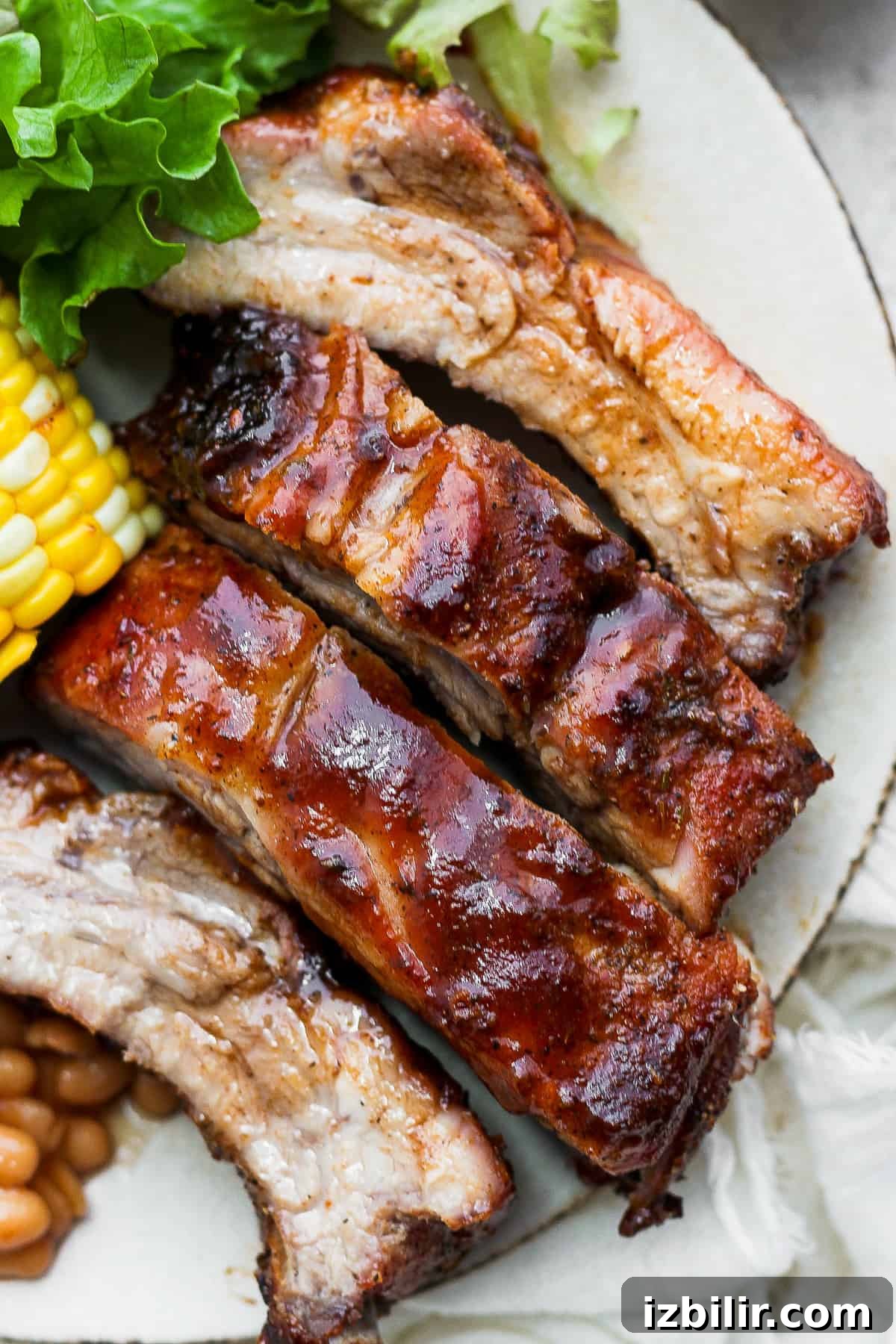 Dry rubbed ribs on a plate.