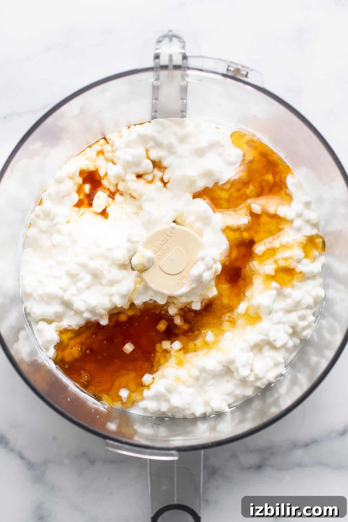 cottage cheese blended smooth in a food processor for making cottage cheese ice cream.
