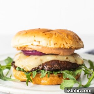 Grilled Portobello Mushroom Recipe with Garlic and Balsamic 2 Portobello mushroom burger on a plate.