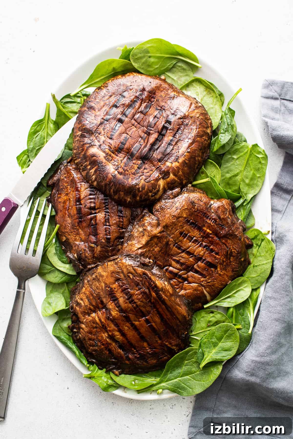 Grilled portobello mushrooms on a plate. Grilled portobello mushrooms on a plate.