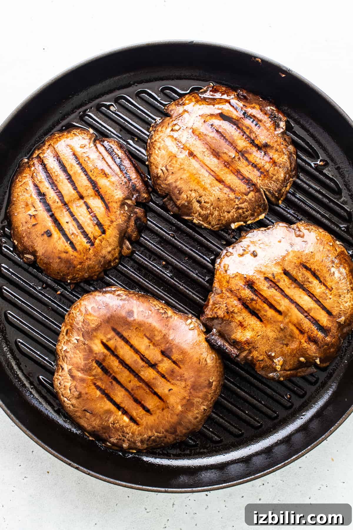 Mushrooms on the grill. Portobello mushroom caps in a grill pan.