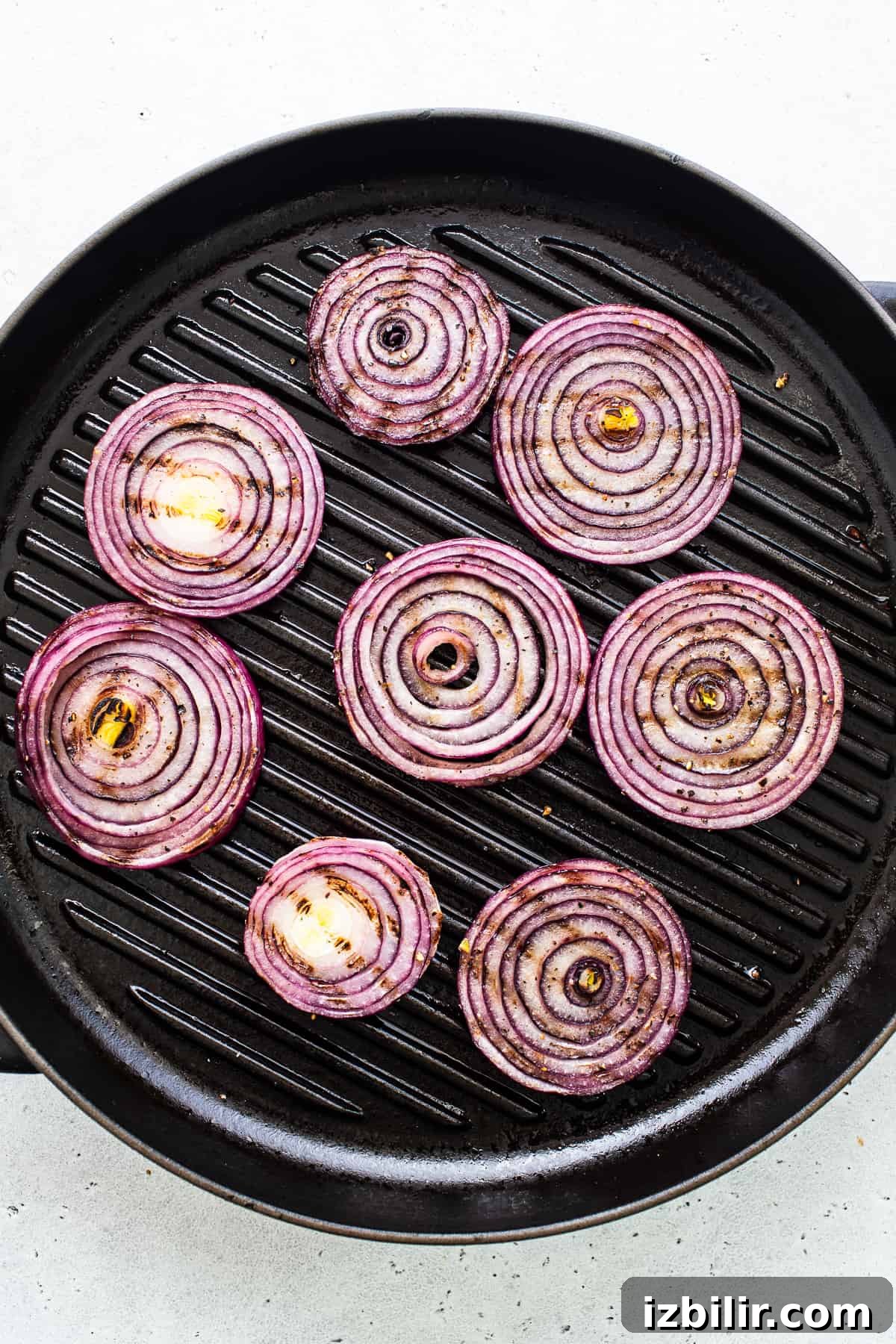 Grilled red onions. Red onions in a grill pan.