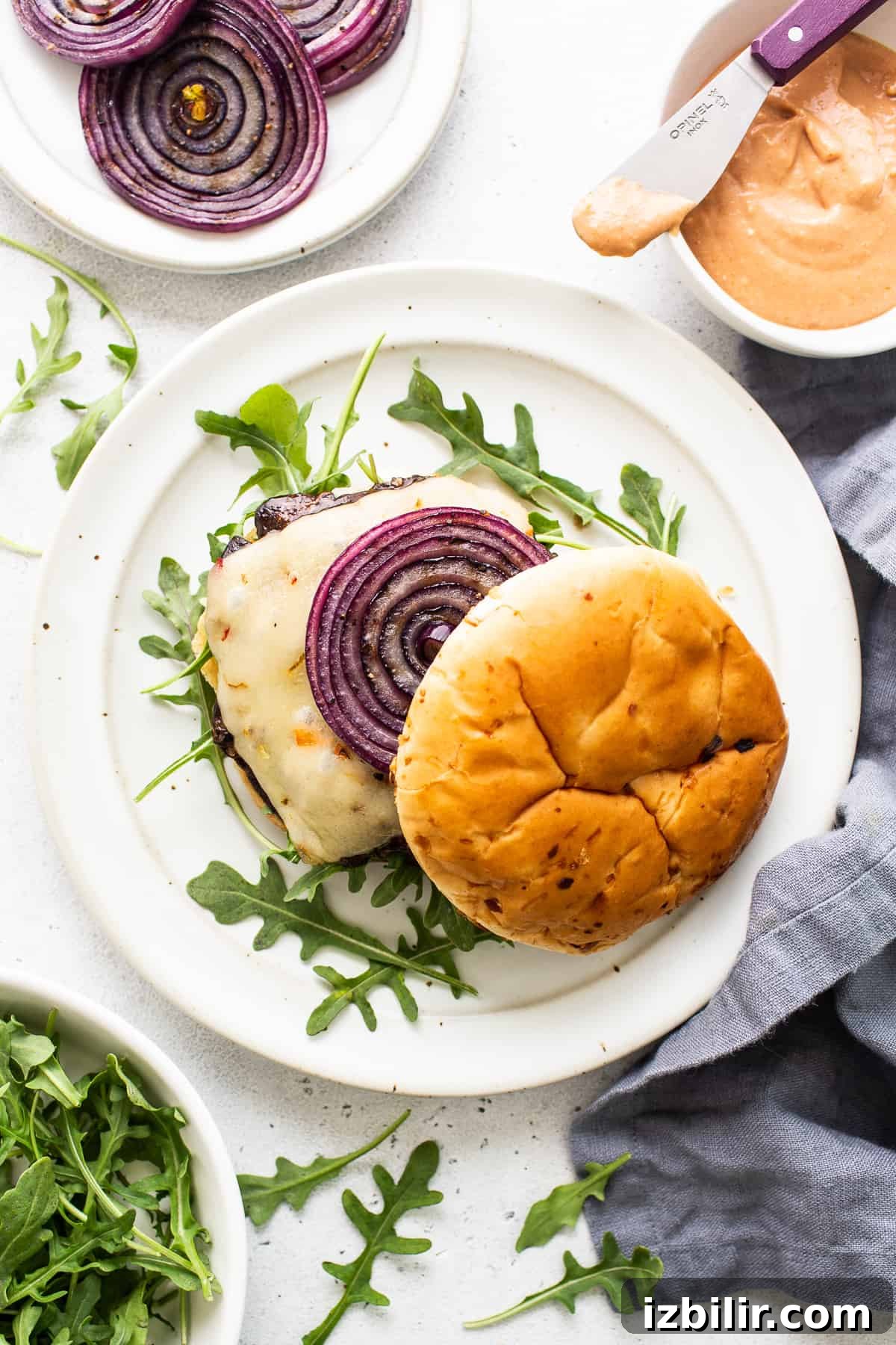 Finished portobello mushroom burger. Portobello mushroom burger on a plate.
