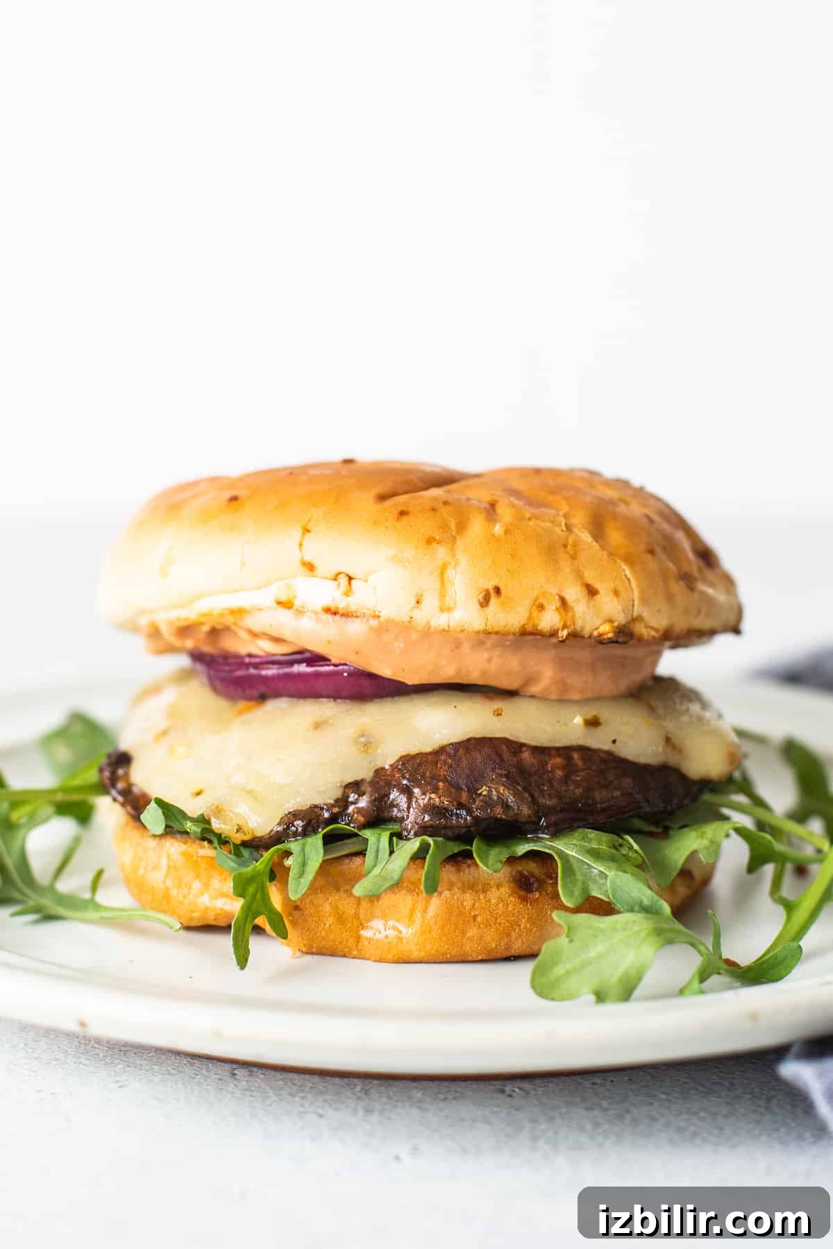 Portobello mushroom burger close-up. Portobello mushroom burger on a plate.