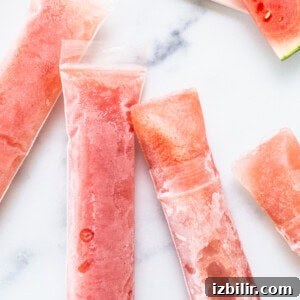 Close-up of watermelon wine pops on the counter.