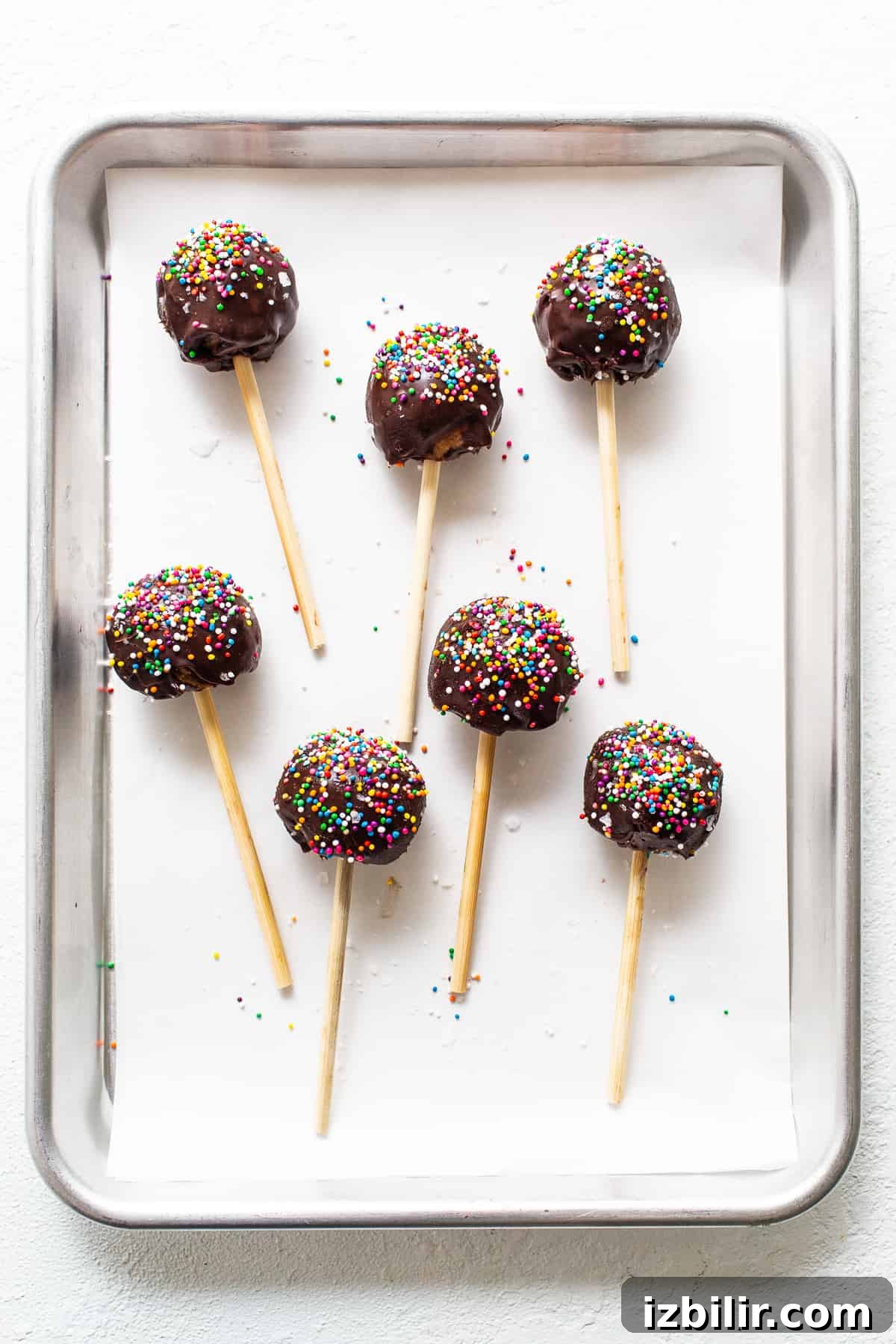 High-Protein Cake Pop Recipe 7 Protein cake pops on a cookie sheet.