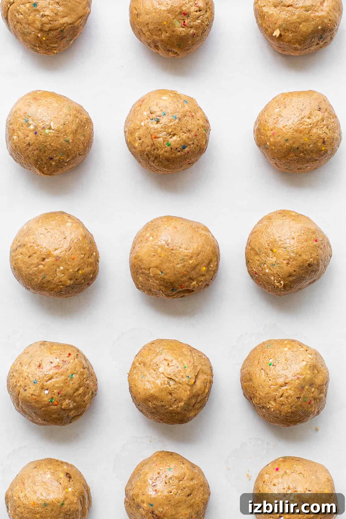 High-Protein Cake Pop Recipe 6 Protein cake pop balls on a cookie sheet.