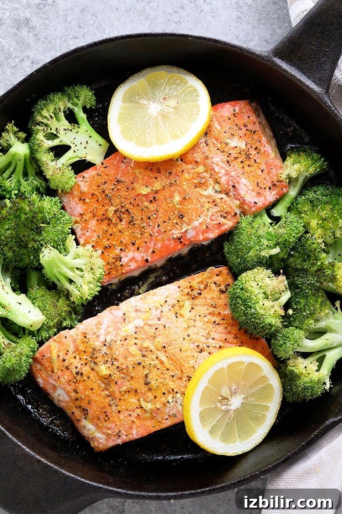 Two baked salmon filets seasoned with lemon pepper