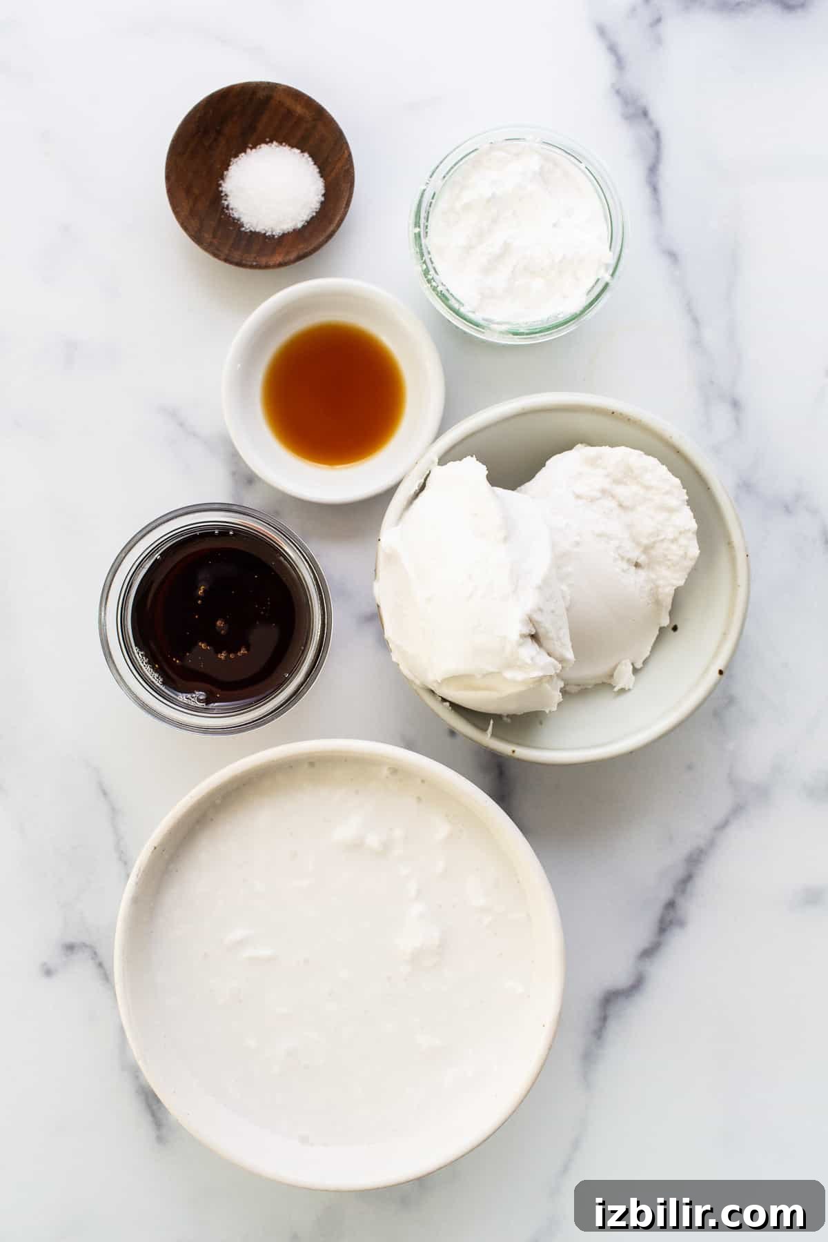 Coconut Cream Pie Bars with Toasted Coconut Topping 3 Bowls of ingredients on a marble table.