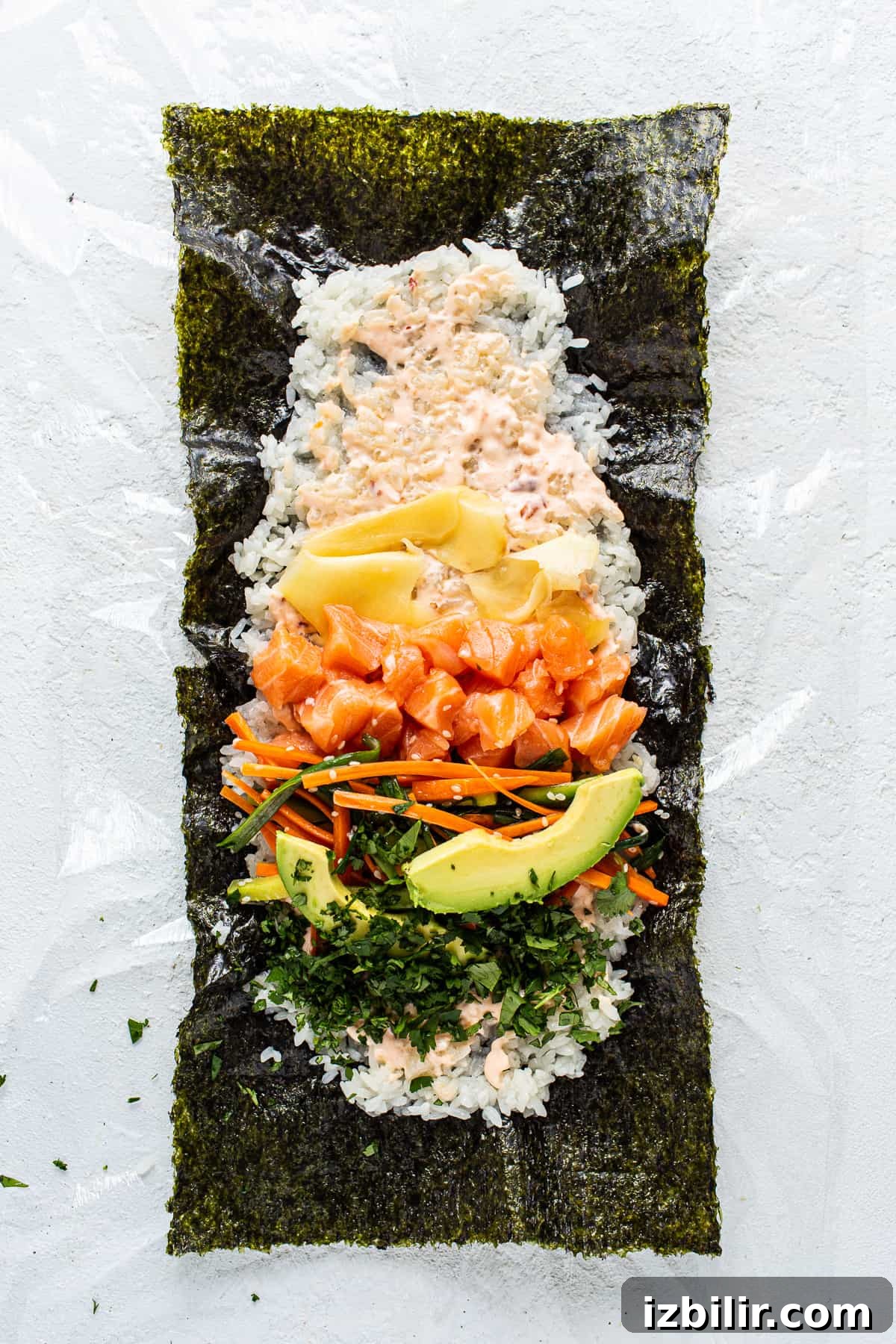 How to Make a Salmon Sushi Burrito at Home 4 a sushi platter with salmon, avocado, carrots, and.