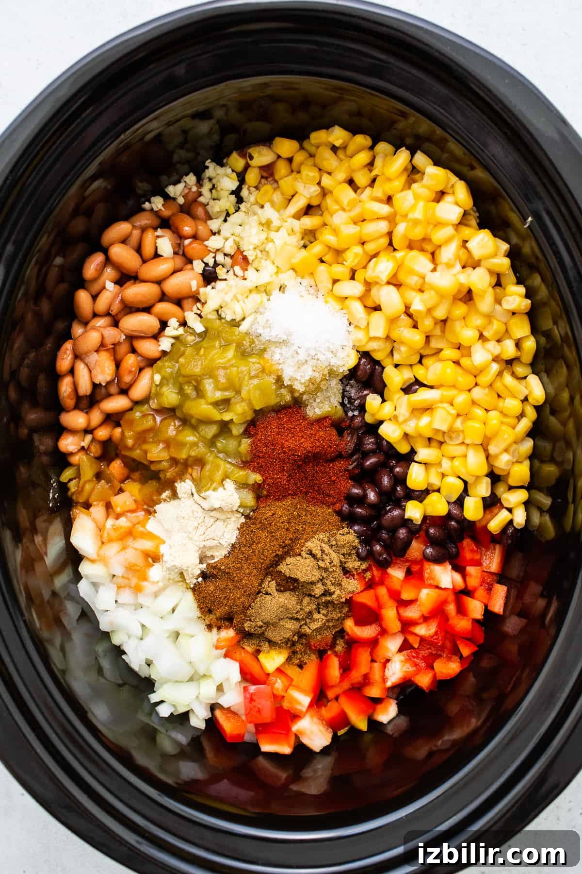 Ingredients for chicken tortilla soup in a slow cooker. Ingredients for chicken tortilla soup in a slow cooker.