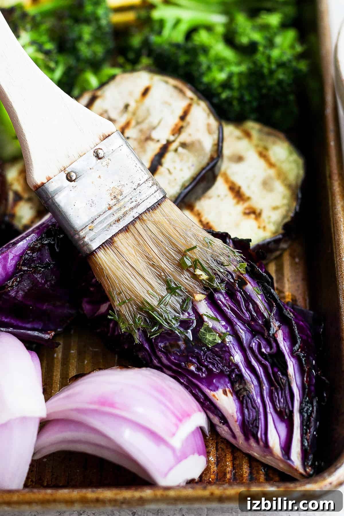 Grilled Rainbow Vegetables Recipe with Balsamic Glaze 6 A close up of a brush with food in it.