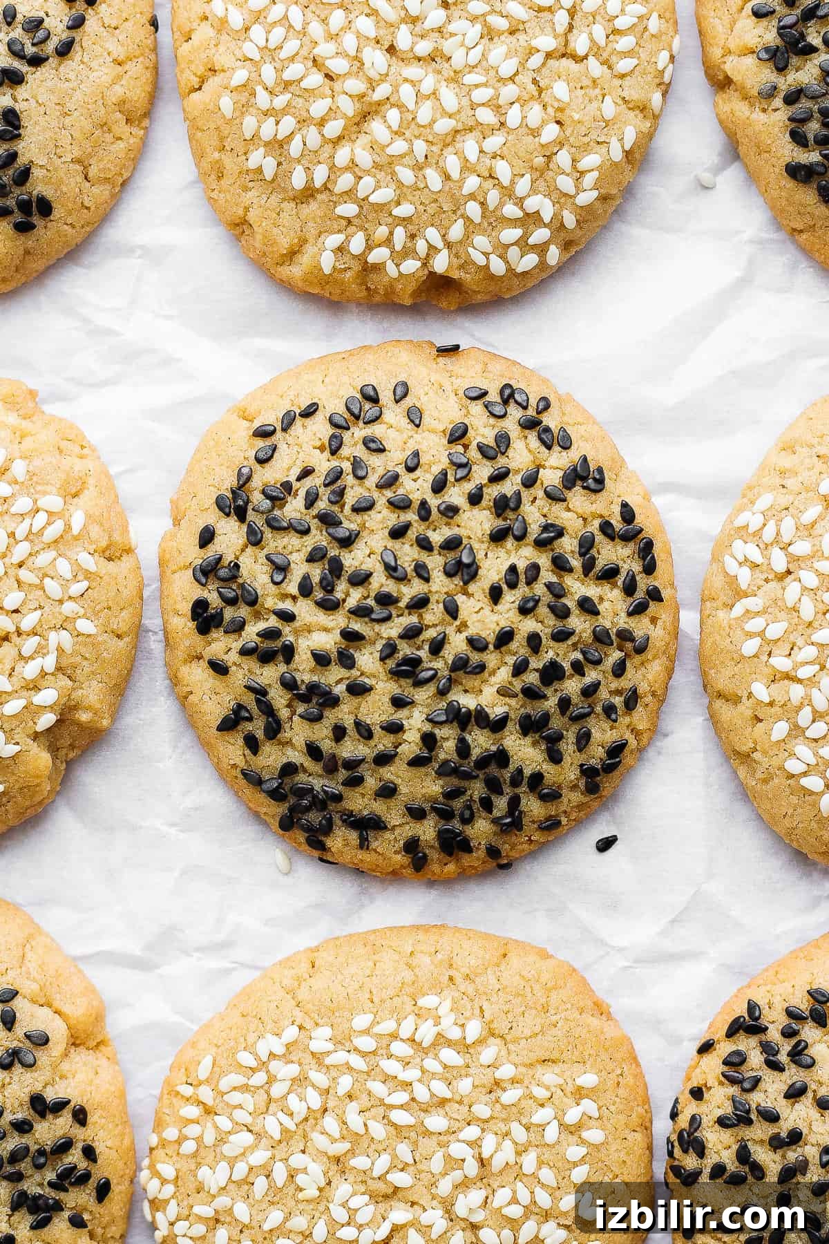 Chewy Tahini Cookies Recipe 2 sesame cookies with black sesame seeds.