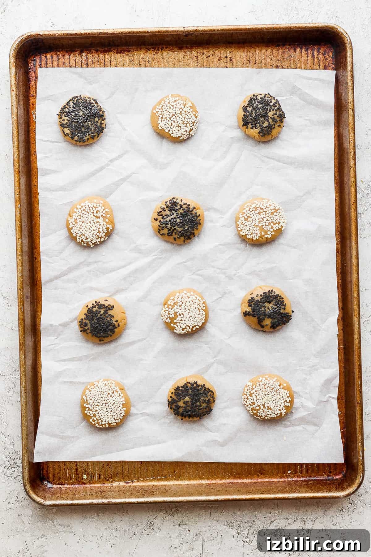 Chewy Tahini Cookies Recipe 6 sesame sesame cookies on a baking sheet.