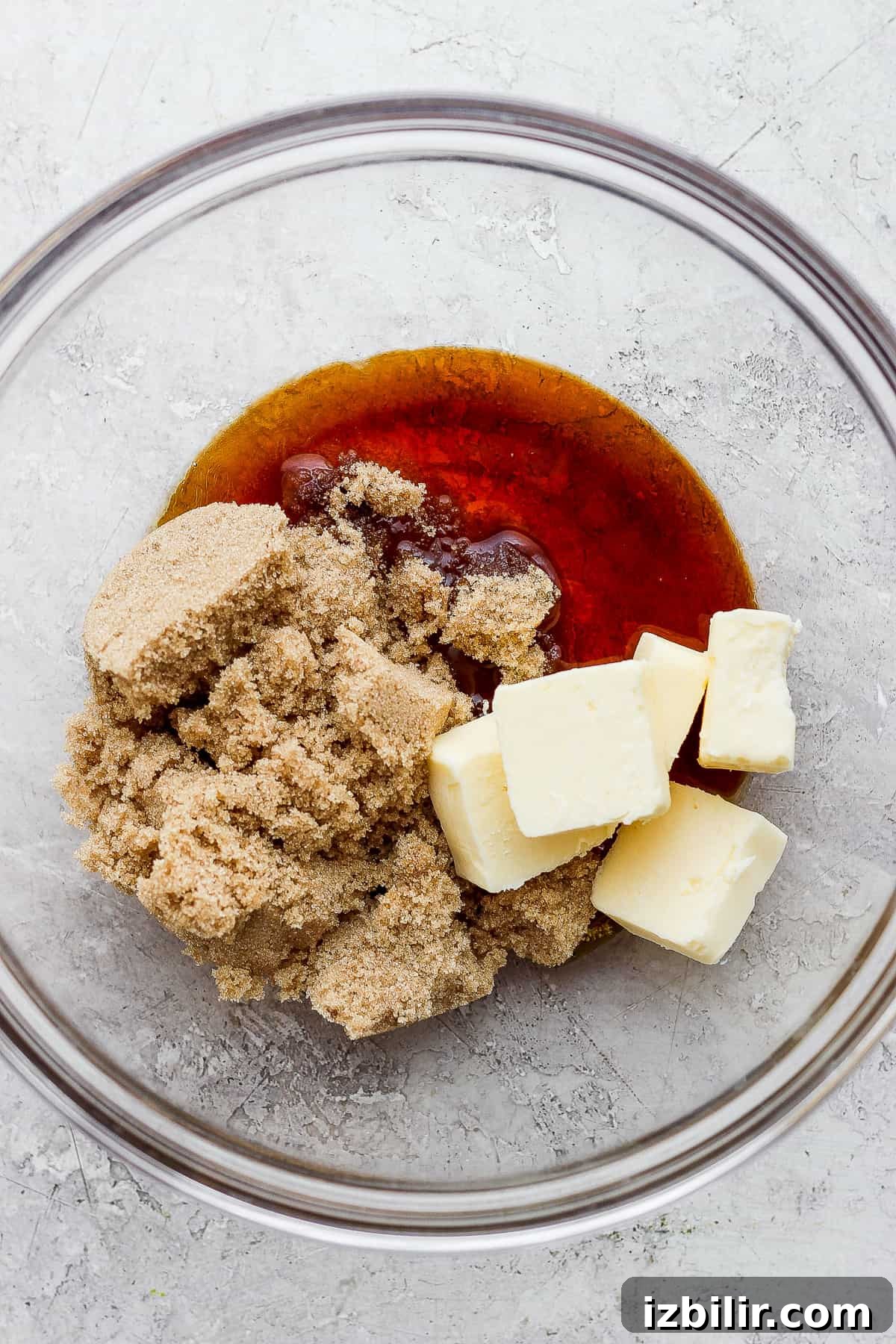 Chewy Tahini Cookies Recipe 3 a bowl filled with butter and sugar.