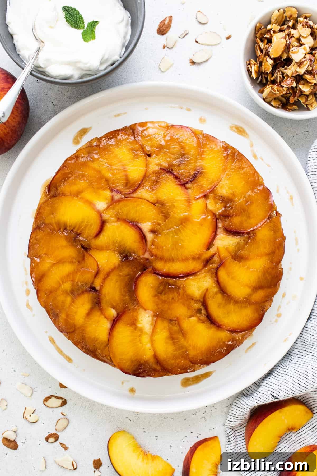 Caramelized Peach Upside Down Cake Recipe 5 Peach upside down cake on a white plate.