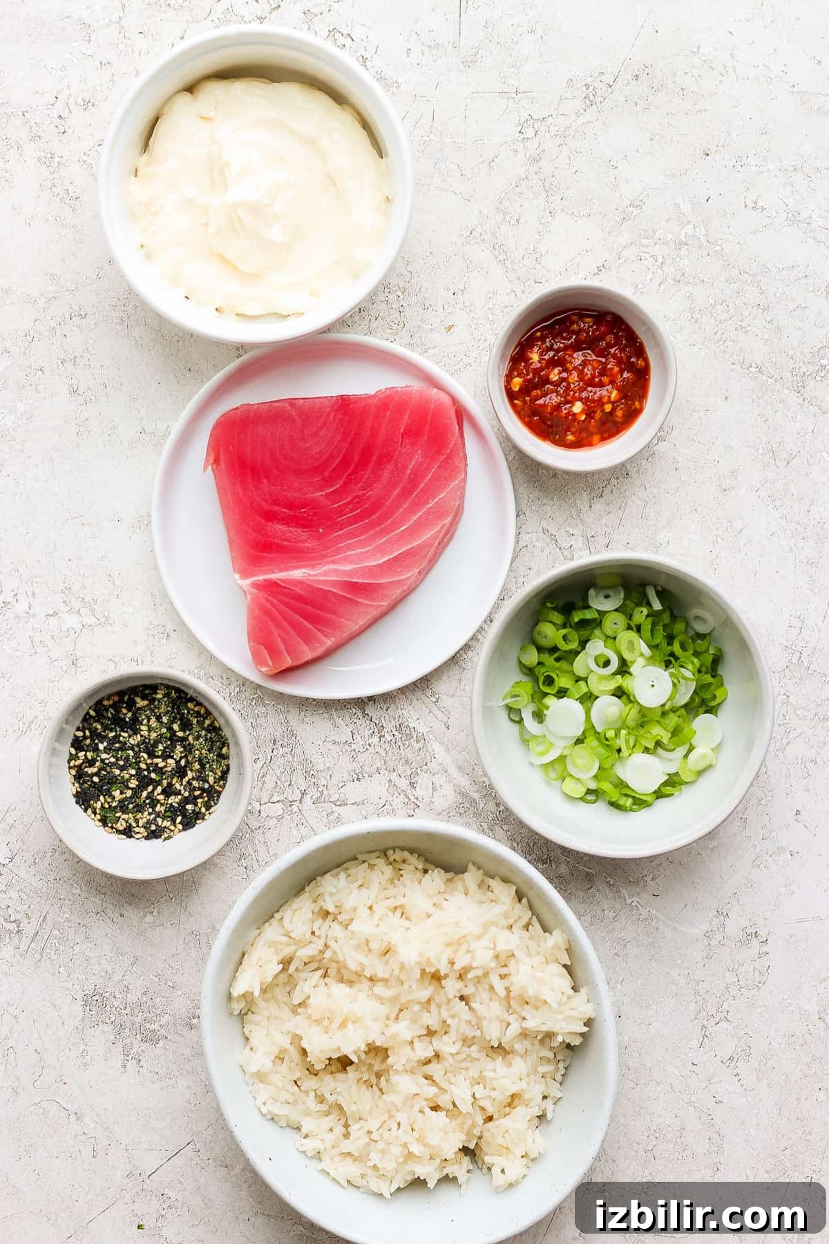 Spicy Tuna Roll Recipe: How to Make at Home 3 the ingredients for a tuna salad.