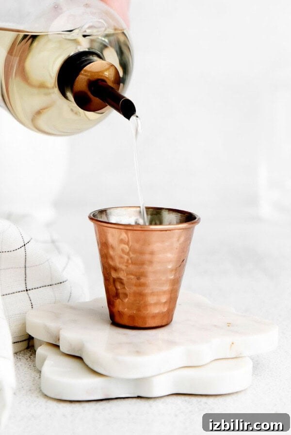 simple syrup in shot glass.