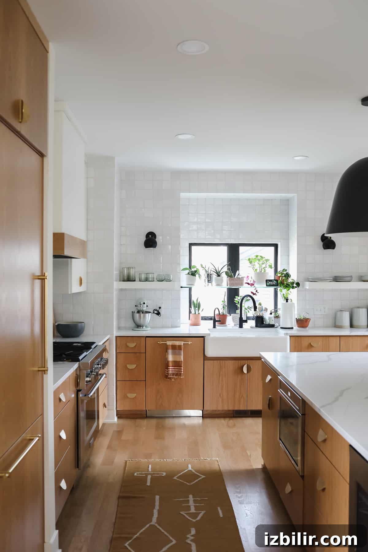 Welcome to the kitchen of my dreams! This post is all about kitchen appliances and my experience with Twin Cities appliances store Warners’ Stellian. kitchen with white tile and black light fixture.