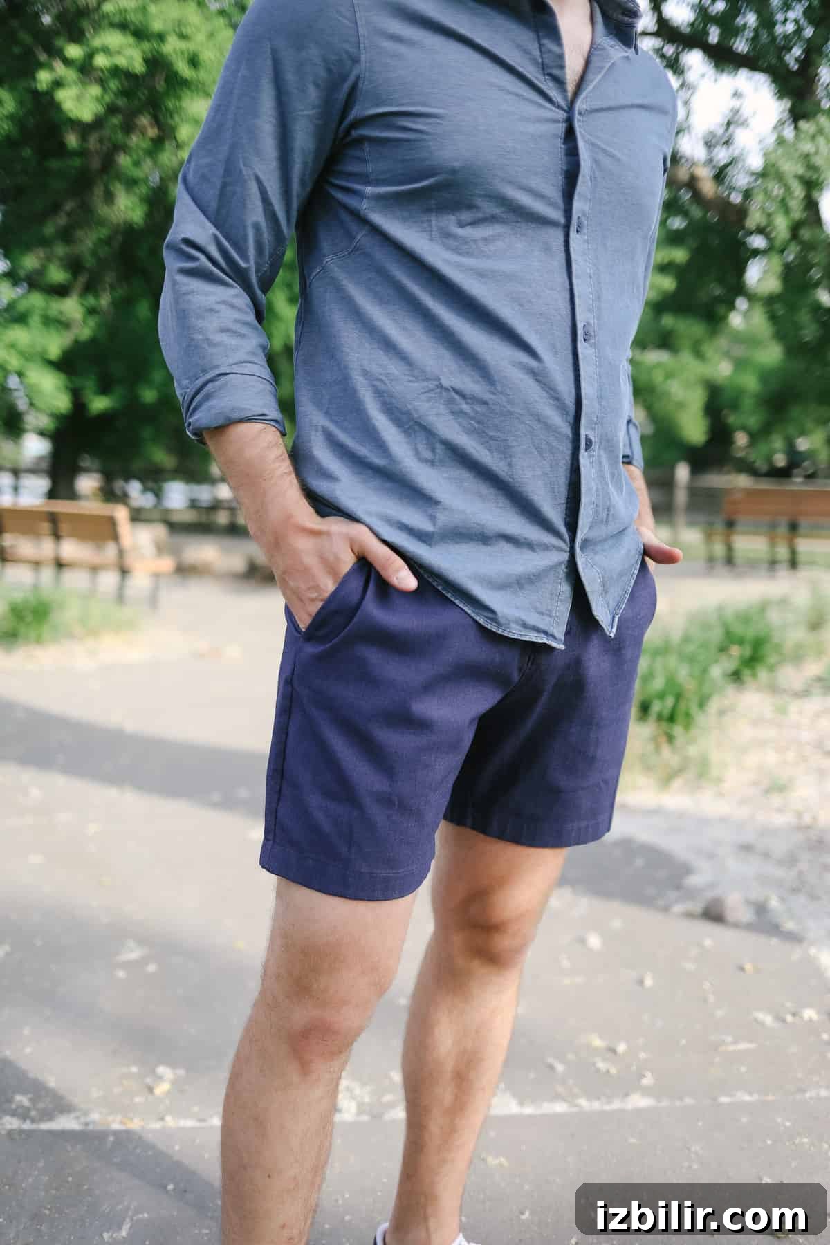 Man posing in blue outfit for a photo.