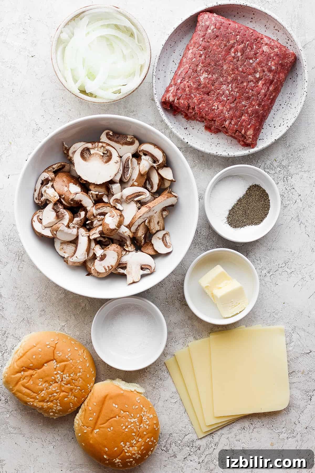 Grilled Mushroom Swiss Burger Recipe 3 the ingredients for a hamburger with mushrooms and cheese.