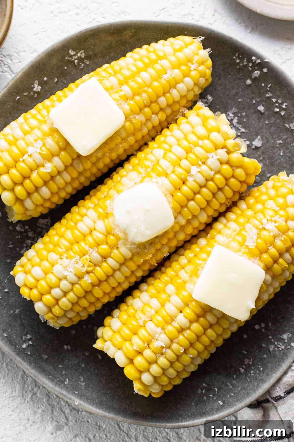 How to Boil Corn on the Cob for Tender, Juicy Kernels 5 Served corn on the cob with butter and salt