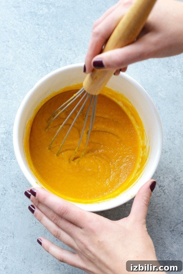 Whisking pumpkin puree Pumpkin puree in a bowl being whisked