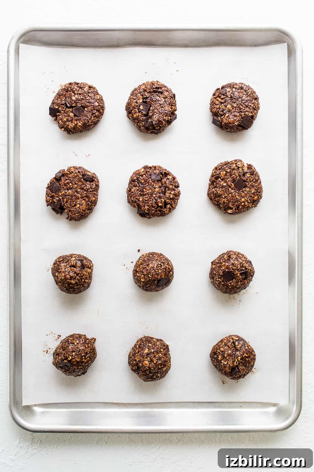 Chewy Chocolate Peanut Butter Oatmeal Cookies Recipe 4 Chocolate oatmeal cookies on a baking sheet.
