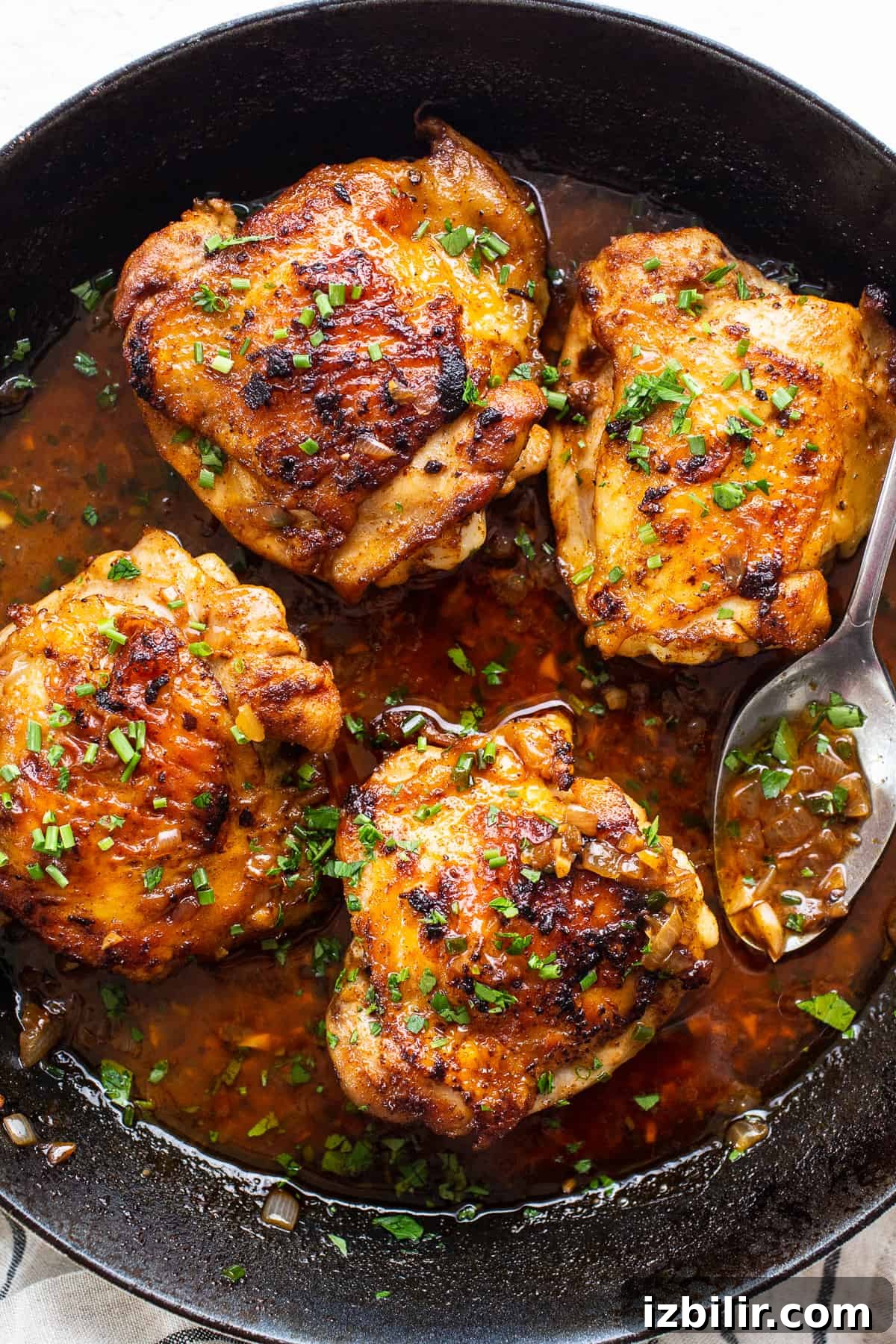 Crispy Cast-Iron Skillet Chicken Thighs 6 Served chicken thighs with garnish