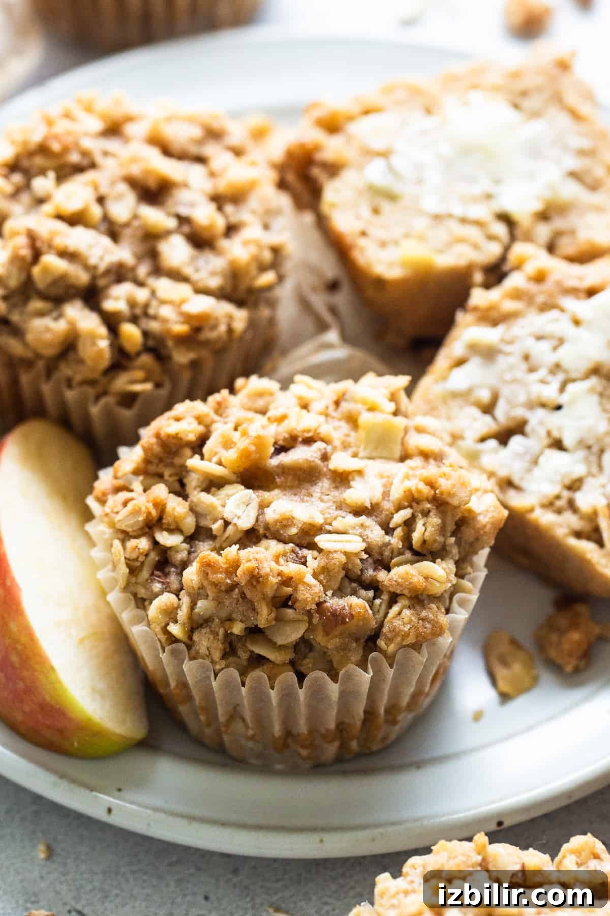 apple granola muffins on a white plate.