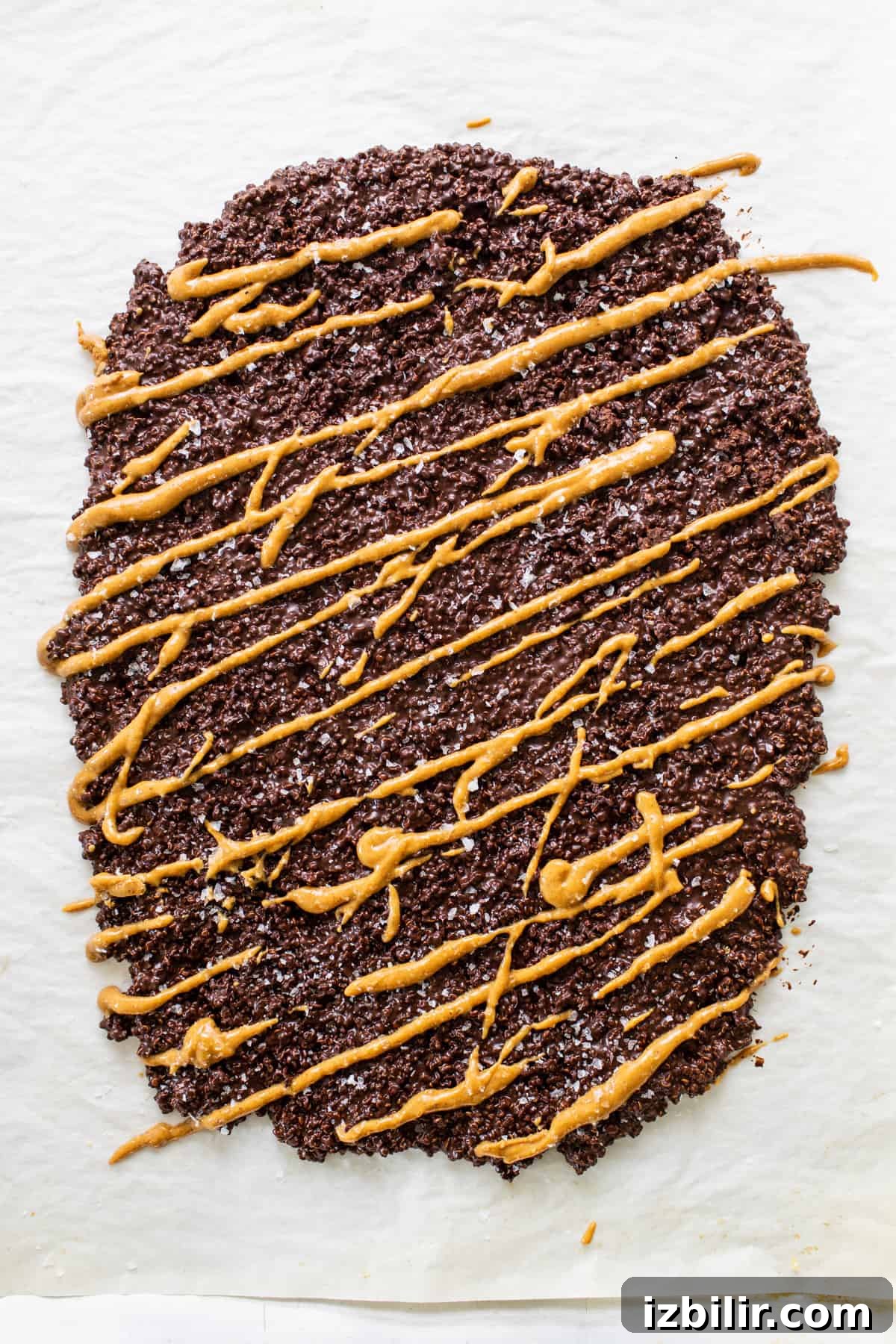 Crunchy Chocolate Quinoa Crisps Recipe 5 a piece of chocolate cake with caramel drizzle on top.