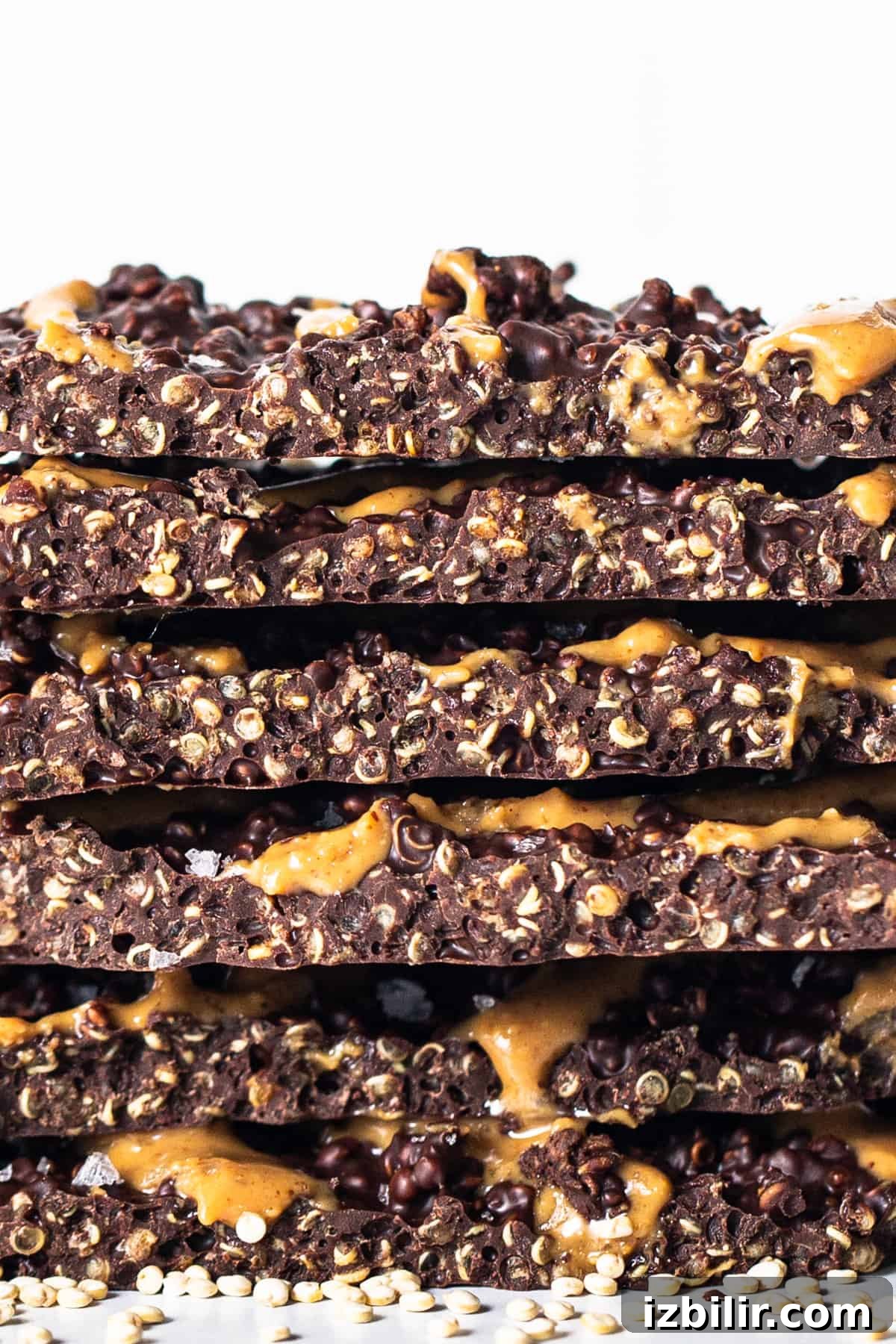 Crunchy Chocolate Quinoa Crisps Recipe 8 a stack of chocolate and caramel granola bars.
